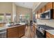 Bright kitchen with stainless steel appliances and breakfast nook with backyard view at 5330 W Morgan Pl, Chandler, AZ 85226