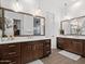 Spacious bathroom features dual vanities with granite countertops, decorative mirrors, and modern fixtures at 5457 S Benton --, Mesa, AZ 85212