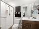 Modern bathroom design with glass shower, dark vanity, and contemporary fixtures offering a luxurious and clean aesthetic at 5457 S Benton --, Mesa, AZ 85212