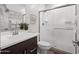 Modern bathroom featuring a glass-enclosed shower, white vanity, and contemporary fixtures, offering a clean aesthetic at 5457 S Benton --, Mesa, AZ 85212