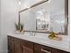 Stylish bathroom vanity with a large mirror, pendant lights, and unique decorative accents at 5457 S Benton --, Mesa, AZ 85212