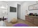Well-lit bedroom features wood floors, a large dresser, and a cozy beanbag chair for a relaxing atmosphere at 5457 S Benton --, Mesa, AZ 85212