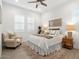 Inviting bedroom showcasing a cozy chair, decorative rug, and neutral tones that create a tranquil and relaxing atmosphere at 5457 S Benton --, Mesa, AZ 85212