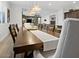 Dining room with hardwood table, decorative centerpiece and view to living area at 5457 S Benton --, Mesa, AZ 85212
