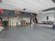 Spacious garage with epoxy flooring and ample storage space with overhead shelving and organization at 5457 S Benton --, Mesa, AZ 85212