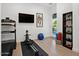 Home gym with exercise equipment and large windows for plenty of natural light at 5457 S Benton --, Mesa, AZ 85212