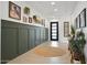 Inviting hallway showcasing wainscoting, neutral walls, and decorative elements for a welcoming transition between spaces at 5457 S Benton --, Mesa, AZ 85212