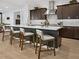Modern kitchen with white countertops, stainless steel appliances, and island with seating at 5457 S Benton --, Mesa, AZ 85212
