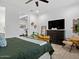 Comfortable main bedroom with plantation shutters, a ceiling fan, and modern furnishings at 5457 S Benton --, Mesa, AZ 85212