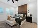 Serene main bedroom featuring wood accent wall, neutral tones, and ample natural light at 5457 S Benton --, Mesa, AZ 85212