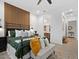 Lovely main bedroom with decorative wood paneling, bench, and an open doorway at 5457 S Benton --, Mesa, AZ 85212