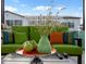 Relaxing outdoor seating area with comfortable cushions, and a view of the serene waterfall feature at 5457 S Benton --, Mesa, AZ 85212