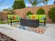 Inviting patio with comfortable seating around a modern fire pit, ideal for outdoor gatherings at 5457 S Benton --, Mesa, AZ 85212