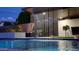 Stunning pool featuring a waterfall, with an outdoor lounge area and an entertainment setup at 5457 S Benton --, Mesa, AZ 85212