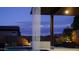 Evening view of backyard pool with waterfall feature and cozy lounge area, perfect for relaxation at 5457 S Benton --, Mesa, AZ 85212