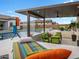 Luxurious outdoor living area with a pool, waterfall feature, and comfortable seating for relaxation at 5457 S Benton --, Mesa, AZ 85212