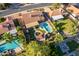 Aerial view of desert community showing sparkling pools, lush landscaping, and inviting backyards at 5831 W Saragosa St, Chandler, AZ 85226