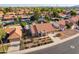 Aerial view of a desert home, lush mature landscaping and a sparkling pool at 5831 W Saragosa St, Chandler, AZ 85226