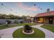 Enjoy a peaceful outdoor living area featuring artificial turf, gazebo, porch swing, and desert landscaping at 5831 W Saragosa St, Chandler, AZ 85226
