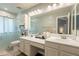 Bathroom boasts dual sinks, ample counter space, and glass enclosed shower at 5831 W Saragosa St, Chandler, AZ 85226
