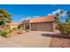 Charming single-story home with a terra cotta roof, desert landscaping, and a two-car garage at 5831 W Saragosa St, Chandler, AZ 85226