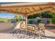 Gazebo features a built-in grill, dining table, and chairs, and an outdoor geometric rug at 5831 W Saragosa St, Chandler, AZ 85226