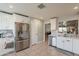 Bright kitchen features white cabinetry, stainless steel appliances, and neutral countertops at 5831 W Saragosa St, Chandler, AZ 85226