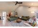 Large living room with vaulted ceiling, neutral paint, modern furnishings, and tile floors at 5831 W Saragosa St, Chandler, AZ 85226