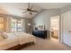 Serene main bedroom with vaulted ceiling, neutral carpet, and ensuite bathroom access at 5831 W Saragosa St, Chandler, AZ 85226