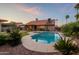 Relaxing pool with baja step, attached spa, and a lush backyard with mature desert landscaping at 5831 W Saragosa St, Chandler, AZ 85226