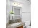 Bathroom featuring a decorative mirror, sink, and granite countertop, offering a blend of functionality and style at 6011 N 2Nd St, Phoenix, AZ 85012