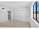 Bedroom with multiple closets and a large window offering plenty of storage and natural light, maximizing space at 6011 N 2Nd St, Phoenix, AZ 85012