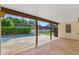 Spacious covered patio with stone flooring overlooking a refreshing pool and landscaped backyard at 6011 N 2Nd St, Phoenix, AZ 85012