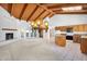 Bright, open-concept living room and kitchen area featuring a fireplace, large windows, and unique light fixture at 6011 N 2Nd St, Phoenix, AZ 85012