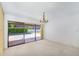 Bright living room with sliding glass doors opening to a private pool and patio area, perfect for indoor-outdoor living at 6011 N 2Nd St, Phoenix, AZ 85012