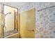 Unique shower with natural light and stone accents, featuring a door to the outside, creating a spa-like experience at 6011 N 2Nd St, Phoenix, AZ 85012