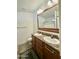 Bathroom showcasing a dual sink vanity with a large mirror and a shower/tub combo at 650 N Hawes Rd # 2827, Mesa, AZ 85207