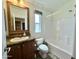 Bathroom with a vanity, toilet and a shower/tub combo with white tile surround at 650 N Hawes Rd # 2827, Mesa, AZ 85207
