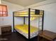 Bedroom showcasing a bunk bed with a yellow blanket and two side tables at 650 N Hawes Rd # 2827, Mesa, AZ 85207