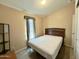 Bedroom featuring neutral colors, window with shades and carpeted flooring at 650 N Hawes Rd # 2827, Mesa, AZ 85207