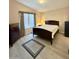Bedroom with neutral paint, wood bed frame and a window providing natural light at 650 N Hawes Rd # 2827, Mesa, AZ 85207