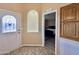 Inviting entryway featuring neutral walls, decorative niche, and view to a bedroom at 650 N Hawes Rd # 2827, Mesa, AZ 85207