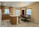 Well-appointed kitchen featuring granite countertops, island with seating, and an adjacent dining area at 650 N Hawes Rd # 2827, Mesa, AZ 85207
