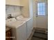Laundry room area featuring a washer and dryer and a door at 650 N Hawes Rd # 2827, Mesa, AZ 85207