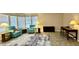 Comfortable living room featuring tile flooring, plush chairs, and a bright, airy atmosphere at 650 N Hawes Rd # 2827, Mesa, AZ 85207