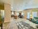 Open-concept living space featuring a dining area, kitchen with island and lots of natural light at 650 N Hawes Rd # 2827, Mesa, AZ 85207