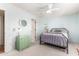 Bright bedroom boasts blue walls, neutral carpet, ceiling fan, and a green chest of drawers at 6533 E Kelton Ln, Scottsdale, AZ 85254