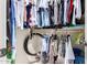 Well-organized walk-in closet with hanging clothes, shelves, and closet rod at 6533 E Kelton Ln, Scottsdale, AZ 85254