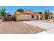 A well-maintained single-story home featuring desert landscaping and an attached two-car garage at 6533 E Kelton Ln, Scottsdale, AZ 85254