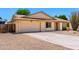 A well-maintained single-story home featuring desert landscaping and an attached two-car garage at 6533 E Kelton Ln, Scottsdale, AZ 85254